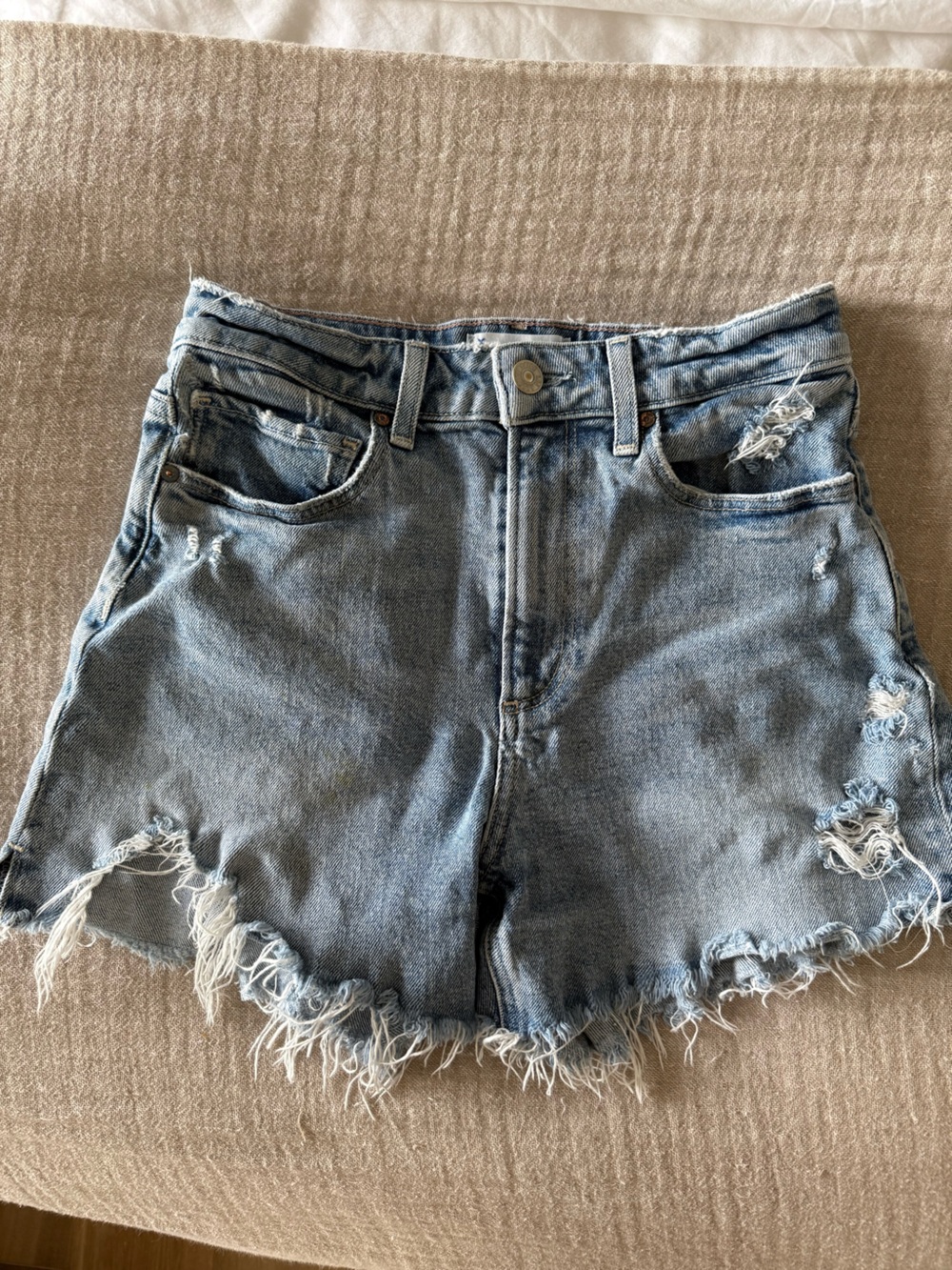 PAIGE Distressed Light Blue Denim Cutoff Shorts